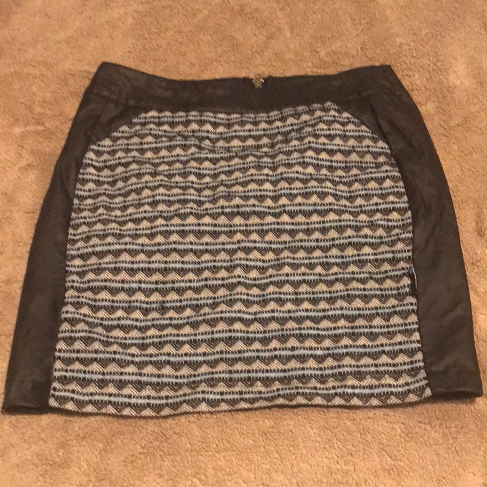 Cute skirt with leather on the side.